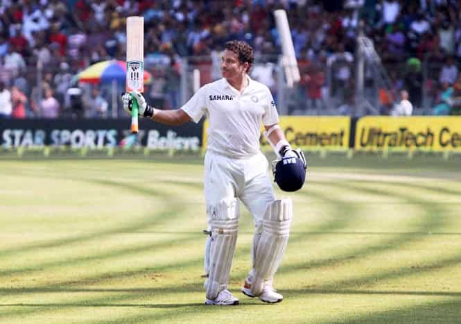 Sachin Tendulkar acknowledges the affection and support of the spectators as he walks off the field at Wankhede Stadium in Mumbai on Friday. (PTI Photo)</em></strong>
</div) Sachin Tendulkar acknowledges the affection and support of the spectators as he walks off the field at Wankhede Stadium in Mumbai on Friday. (PTI Photo)</em></strong>
</div)