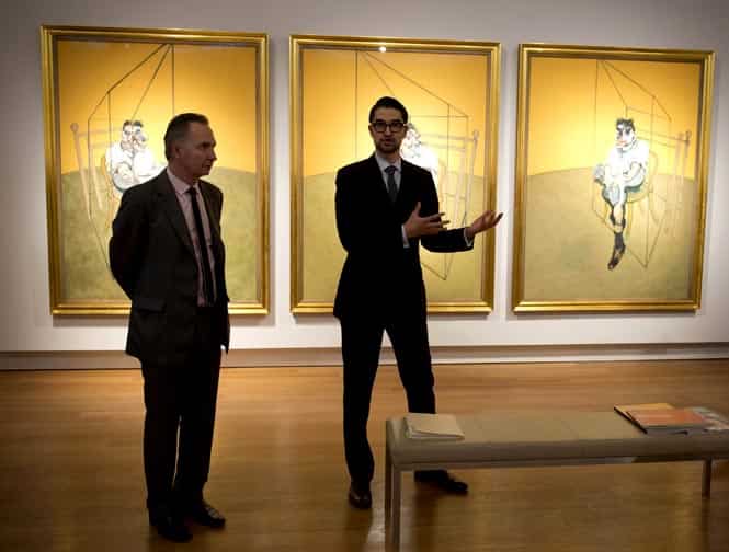 File photo shows spokesmen from Christie's speaking about Francis Bacon's "Three Studies of Lucian Freud" (background) at Christie's in New York. (AFP Photo) File photo shows spokesmen from Christie's speaking about Francis Bacon's "Three Studies of Lucian Freud" (background) at Christie's in New York. (AFP Photo)