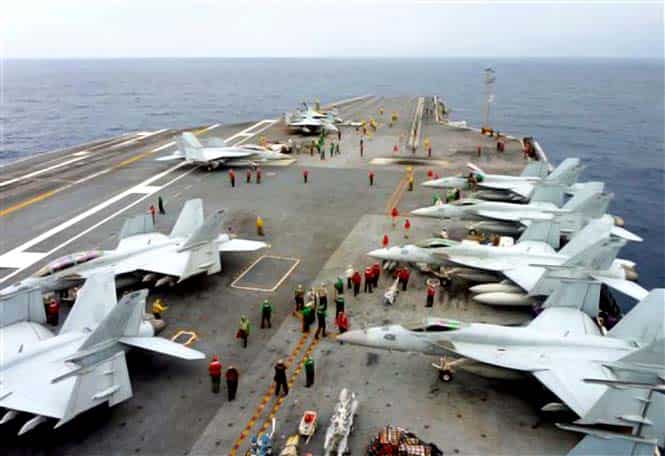 US Navy FA-18 Hornets cram the flight deck of the USS George Washington during a joint military exercise with Japan in the Pacific Ocean near Japan's southernmost island of Okinawa. The 13-day drill ended in the day as an air defense zone newly declared by China. (AP Photo)</em) US Navy FA-18 Hornets cram the flight deck of the USS George Washington during a joint military exercise with Japan in the Pacific Ocean near Japan's southernmost island of Okinawa. The 13-day drill ended in the day as an air defense zone newly declared by China. (AP Photo)</em)