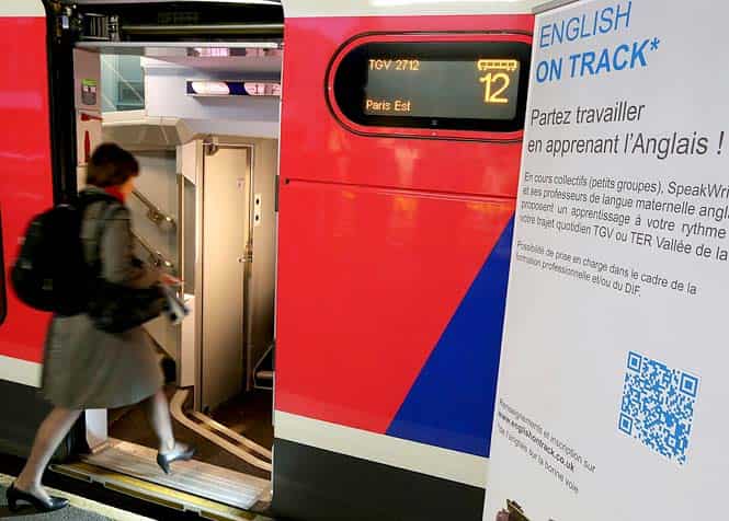 A woman enters a high speed TGV train departing for Paris at Reims train station, in which travellers can have English lessons. (AFP Photo)
</div) A woman enters a high speed TGV train departing for Paris at Reims train station, in which travellers can have English lessons. (AFP Photo)
</div)