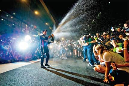 Sebastian Vettel celebrates his win at the Indian Grand Prix with champagne