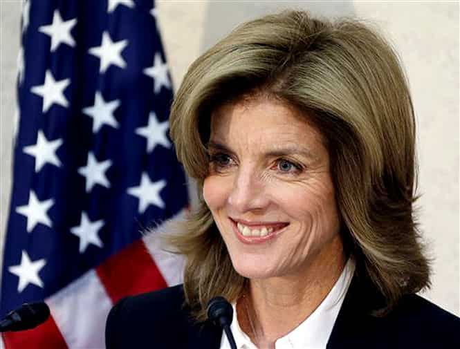 New US Ambassador to Japan Caroline Kennedy smiles as she gives a statement upon her arrival in Japan at the Narita International Airport in Narita, east of Tokyo (AP Photo)</em> 
</div)