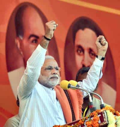 BJP PM candidate Narendra Modi addresses an election rally in Agra. (PTI photo)</em>
</div) BJP PM candidate Narendra Modi addresses an election rally in Agra. (PTI photo)</em>
</div)