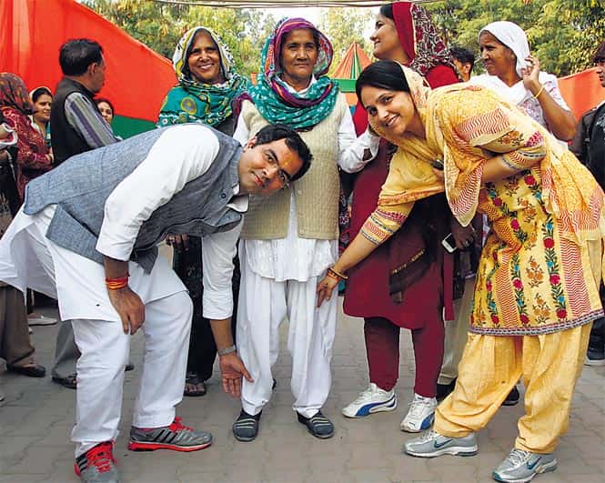 Parvesh Verma with his wife Swati (right) while campaigning in Mehrauli. She has been going door to door to garner support for her husband. (Vijendra Singh Gosain/HT Photo) Parvesh Verma with his wife Swati (right) while campaigning in Mehrauli. She has been going door to door to garner support for her husband. (Vijendra Singh Gosain/HT Photo)