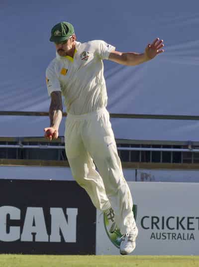 Australian fast bowler Mitchell Johnson takes a difficult catch to dismiss England batsmen Kevin Pietersen on the second day of the third Ashes cricket Test in Perth. (AFP Photo)
</div) Australian fast bowler Mitchell Johnson takes a difficult catch to dismiss England batsmen Kevin Pietersen on the second day of the third Ashes cricket Test in Perth. (AFP Photo)
</div)
