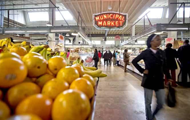 This photo shows shoppers passing through the Sweet Auburn Curb Market in Atlanta. (AP Photo)
</div) This photo shows shoppers passing through the Sweet Auburn Curb Market in Atlanta. (AP Photo)
</div)