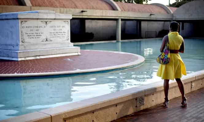 In this file photo, a visitor looks on at the crypt of the Rev. Martin Luther King Jr. and his wife Coretta, along Auburn Avenue in Atlanta. (AP Photo/File)
</div) In this file photo, a visitor looks on at the crypt of the Rev. Martin Luther King Jr. and his wife Coretta, along Auburn Avenue in Atlanta. (AP Photo/File)
</div)