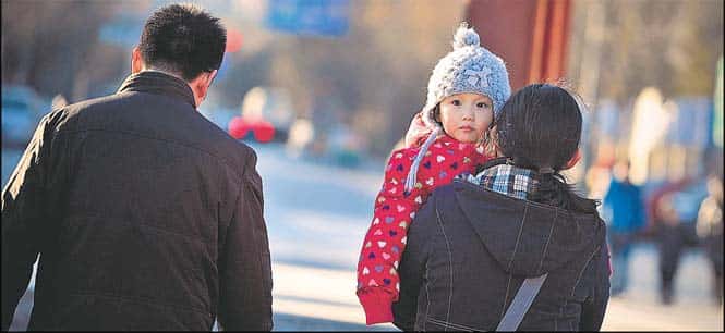 The new policy allows couples to have a second child if either parent is an only child. (AFP)</font></em></strong)