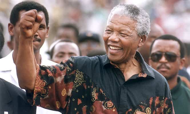 This file photo from 1994 shows Nelson Mandela waving to his supporters. (AP Photo/The Star Tribune, Jerry Holt, File)
</div) This file photo from 1994 shows Nelson Mandela waving to his supporters. (AP Photo/The Star Tribune, Jerry Holt, File)
</div)