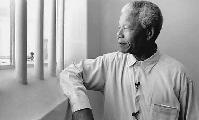Former South Africa's first black president Nelson Mandela revisits his prison cell on Robben Island, where he spent eighteen of his twenty-seven years in prison in 1994. (Getty images)
</div) Former South Africa's first black president Nelson Mandela revisits his prison cell on Robben Island, where he spent eighteen of his twenty-seven years in prison in 1994. (Getty images)
</div)