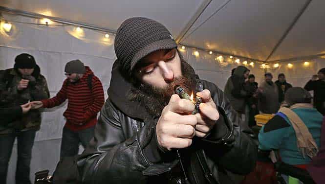 A file photo of a man lighting a marijuana joint at a pot party at the Seattle Center, in Seattle. Colorado pot stores will open on January 1. (AP Photo)</font></em></strong>
</div) A file photo of a man lighting a marijuana joint at a pot party at the Seattle Center, in Seattle. Colorado pot stores will open on January 1. (AP Photo)</font></em></strong>
</div)