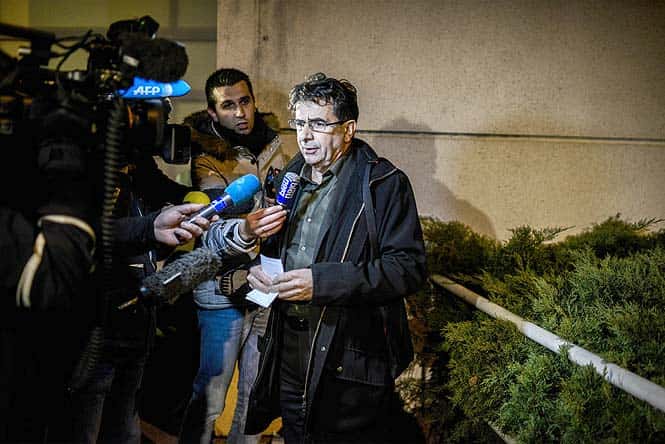 Jean Marc Grenier, the deputy director of the hospital where seven-time Formula one world champion Michael Schumacher is being treated, speaks to the press in Grenoble, in front of the emergency department of the Centre Hospitalier Universitaire hospital. (AFP Photo)