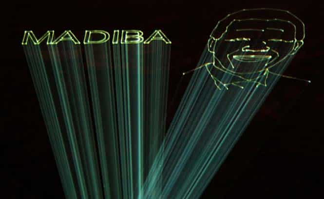 Lasers beam an image of late Nelson Mandela, fondly called, Madiba, projected onto Cape Town's Table Mountain. (AP photo)</strong) Lasers beam an image of late Nelson Mandela, fondly called, Madiba, projected onto Cape Town's Table Mountain. (AP photo)</strong)
