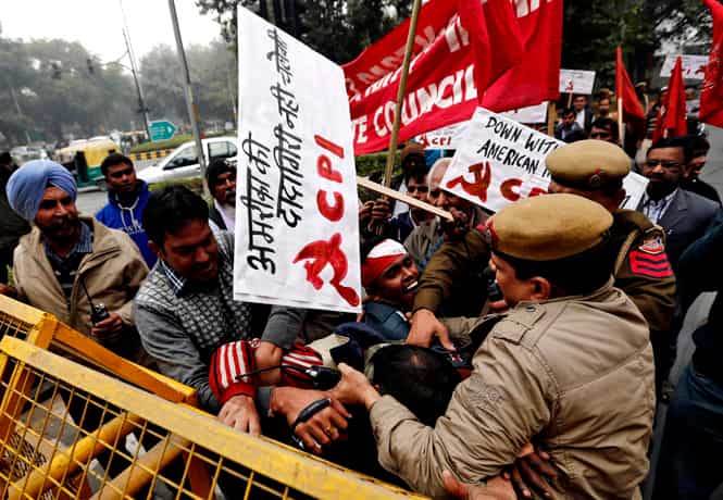 Supporters of CPI scuffle with cops during a protest against Indian diplomat's arrest in US, near the American Center in New Delhi. (Reuters photo) Supporters of CPI scuffle with cops during a protest against Indian diplomat's arrest in US, near the American Center in New Delhi. (Reuters photo)