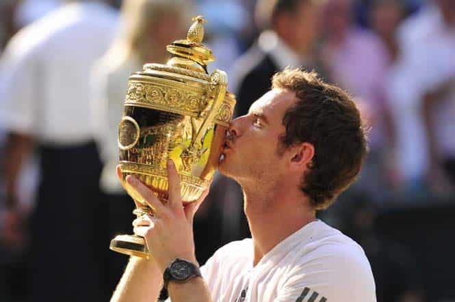 Andy Murray kisses the winner's trophy after beating Novak Djokovic in the men's singles final of the 2013 Wimbledon Championships. (AFP file photo)