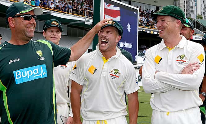 Australia's Coach Darren Lehmann, left, Dave Warner, center, and Brad Haddin, right, celebrate after winning the Ashes.  (AP)