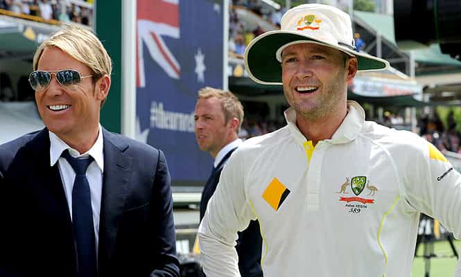 Australian captain Michael Clarke stands alongside former player Shane Warne following Australia's Ashes win.  (AFP)