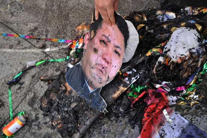 North Korean flag and the face of leader Kim Jong-Un during a protest against North Korea in Seoul. (AFP photo)</em)