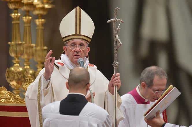 Pope Francis blesses the crowd at the end of a Christmas eve mass at St Peter's Basilica to mark the nativity of Jesus Christ at the Vatican. (AFP)</font></em></strong) Pope Francis blesses the crowd at the end of a Christmas eve mass at St Peter's Basilica to mark the nativity of Jesus Christ at the Vatican. (AFP)</font></em></strong)