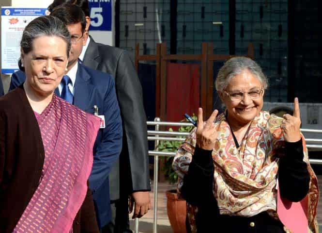 Delhi CM Sheila Dikshit and Congress party president Sonia Gandhi look on after casting their votes in in New Delhi. (AFP photo)</em) Delhi CM Sheila Dikshit and Congress party president Sonia Gandhi look on after casting their votes in in New Delhi. (AFP photo)</em)
