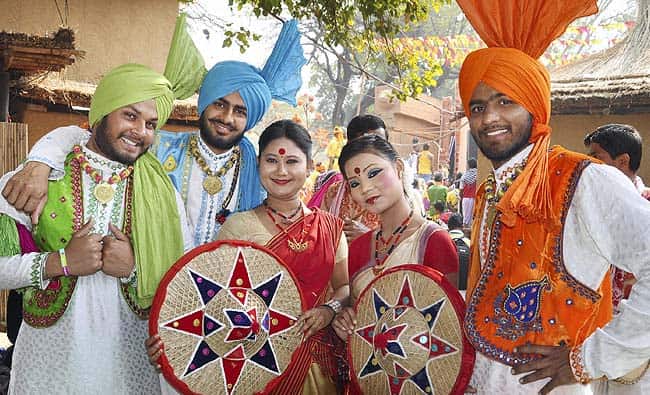 Folk artists pose one for camera during Surajkund International Crafts Mela in Faridabad. Photo: PTI Folk artists pose one for camera during Surajkund International Crafts Mela in Faridabad. Photo: PTI