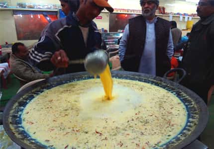 A generous serving of gaadha doodh waiting to be served in a kulhad A generous serving of gaadha doodh waiting to be served in a kulhad