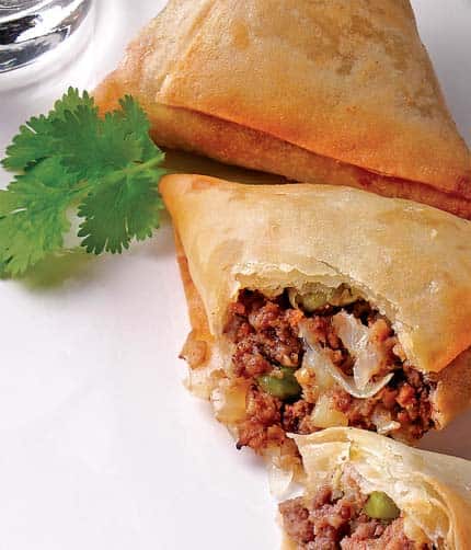 Hindu-Muslim divide: If a dish came to India from the Islamic world, such as the samosa, we have no hesitation in putting meat into it. But if a close relative, say the kachori, is of Hindu origin, then it remains resolutely vegetarian .