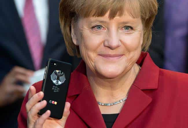 German Chancellor Angela Merkel holds a tap-proof Blackberry on the stand of Secusmart as she tours the CeBIT computer fair in Hannover, northern Germany, Tuesday, March 5, 2013. Secusmart is in the bidding process to provide smartphones for the German government. Photo: AP/dpa, Julian Stratenschulte German Chancellor Angela Merkel holds a tap-proof Blackberry on the stand of Secusmart as she tours the CeBIT computer fair in Hannover, northern Germany, Tuesday, March 5, 2013. Secusmart is in the bidding process to provide smartphones for the German government. Photo: AP/dpa, Julian Stratenschulte