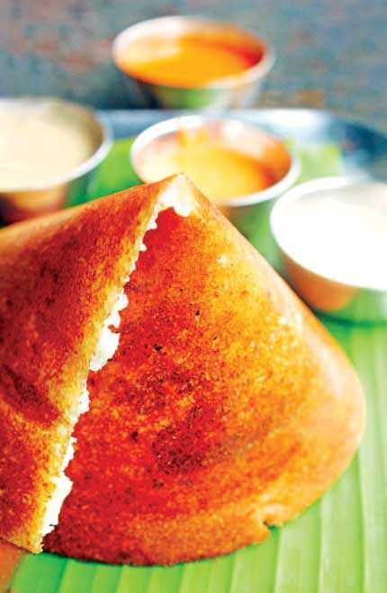 Desi still rules: Reasonably priced south Indian fast food chains like Sagar which serve dosas (left) etc will always outperform a Western chain because they use fresh ingredient) Desi still rules: Reasonably priced south Indian fast food chains like Sagar which serve dosas (left) etc will always outperform a Western chain because they use fresh ingredient)