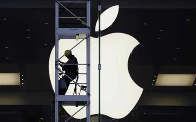 A worker climbs outside an Apple store in Hong Kong. Credit: Reuters/Bobby Yip A worker climbs outside an Apple store in Hong Kong. Credit: Reuters/Bobby Yip