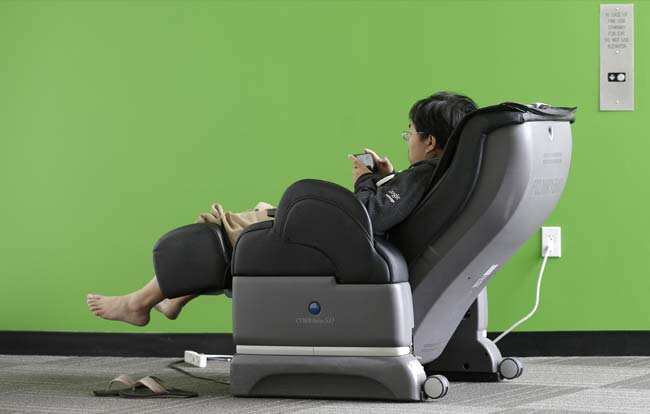 Google software engineer Jiang Chen campus sits in a massage chair at a Google campus building in Mountain View, Calif., Friday, March 15, 2013. Photo: AP/Jeff Chiu Google software engineer Jiang Chen campus sits in a massage chair at a Google campus building in Mountain View, Calif., Friday, March 15, 2013. Photo: AP/Jeff Chiu