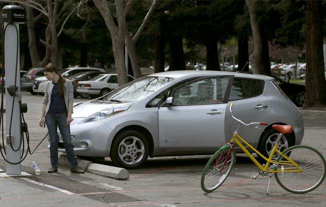 A Google employee plugs in a Google owned car next to a bicycle at the Google campus in Mountain View, Calif., Friday, March 15, 2013. Photo: AP/Jeff Chiu A Google employee plugs in a Google owned car next to a bicycle at the Google campus in Mountain View, Calif., Friday, March 15, 2013. Photo: AP/Jeff Chiu