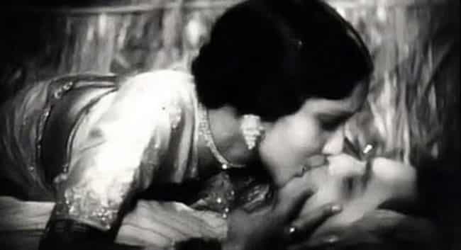 Devika Rani kisses actor/husband Himanshu Rai in the film Karma. This was the first onscreen kiss and supposed to be the longest (four minutes) in Indian films) Devika Rani kisses actor/husband Himanshu Rai in the film Karma. This was the first onscreen kiss and supposed to be the longest (four minutes) in Indian films)