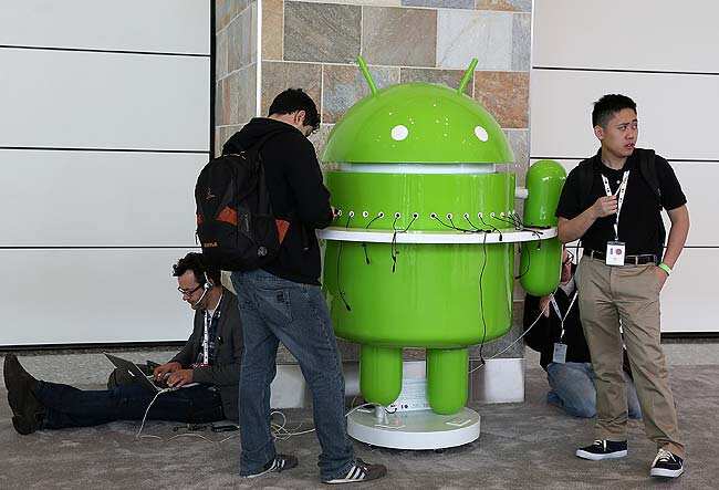 Attendees stand around an Android charging station during the Google I/O developers conference at the Moscone Center in San Francisco, California. Justin Sullivan/Getty Images/AFP Attendees stand around an Android charging station during the Google I/O developers conference at the Moscone Center in San Francisco, California. Justin Sullivan/Getty Images/AFP