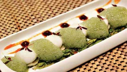 Street side affair: Papri chaat is a sphere of spiced yoghurt (made using a now popular technique called spherification) that explodes in your mouth to yield the flavour of the Indian street (Photo courtesy: Gaggan) Street side affair: Papri chaat is a sphere of spiced yoghurt (made using a now popular technique called spherification) that explodes in your mouth to yield the flavour of the Indian street (Photo courtesy: Gaggan)