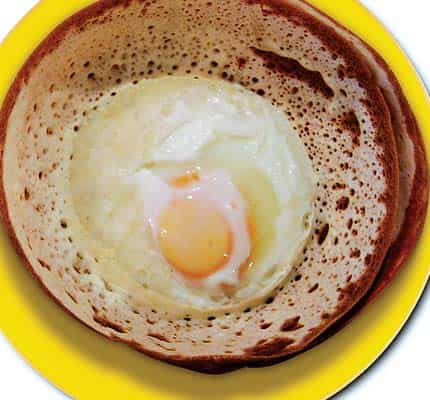 Appam with a twist: The Lankans fry an egg, sunny-side up on their appams and call them egg-hoppers. They can be delicious and are easy to find all over Sri Lanka Appam with a twist: The Lankans fry an egg, sunny-side up on their appams and call them egg-hoppers. They can be delicious and are easy to find all over Sri Lanka