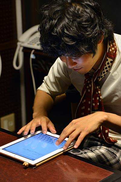 Akihiro Matsumura, a University student writes sentences on a tablet computer in Tokyo. AFP Photo: AFP / Yoshikazu Tsuno Akihiro Matsumura, a University student writes sentences on a tablet computer in Tokyo. AFP Photo: AFP / Yoshikazu Tsuno