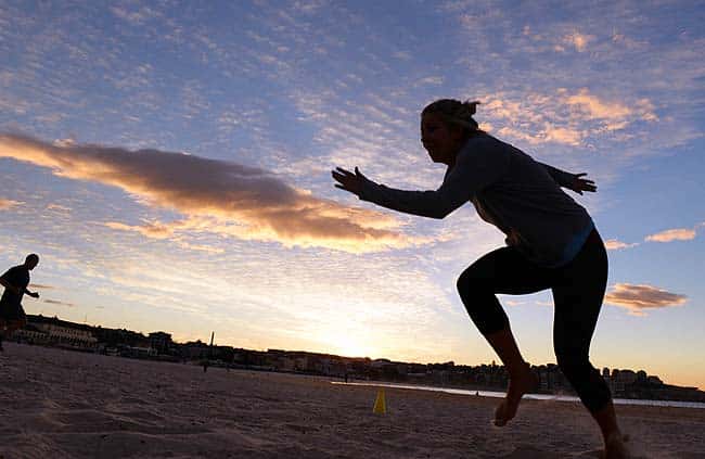 Boot camp enthusiasts work out on Sydney's iconic Bondi Beach. Photo: AFP/William West Boot camp enthusiasts work out on Sydney's iconic Bondi Beach. Photo: AFP/William West