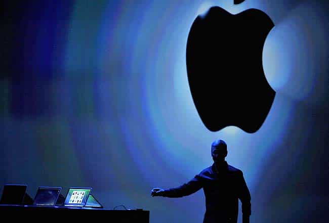 Apple CEO Tim Cook rteaches for iPhone as he speaks at Apple's Worldwide Developer Conference (WWDC) in San Francisco. Photo: AFP/Josh Edelso) Apple CEO Tim Cook rteaches for iPhone as he speaks at Apple's Worldwide Developer Conference (WWDC) in San Francisco. Photo: AFP/Josh Edelso)