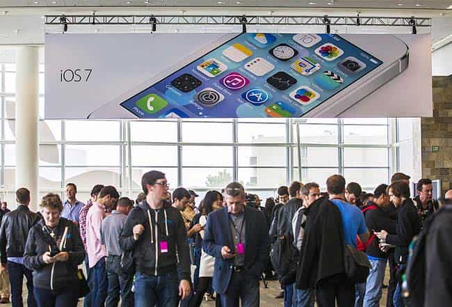 People walk under an iOS7 sign at the 2013 Apple WWDC at the Moscone Center in San Francisco, California. Kim White/Getty Images/AFP People walk under an iOS7 sign at the 2013 Apple WWDC at the Moscone Center in San Francisco, California. Kim White/Getty Images/AFP