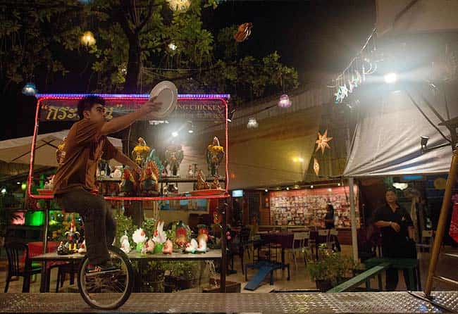 Waiter on a one wheel bicycle catching with a plate, a flying chicken sent by a catapult at the Ka-tron restaurant in Bangkok. Photo: AFP/ Nicolas Asfouri Waiter on a one wheel bicycle catching with a plate, a flying chicken sent by a catapult at the Ka-tron restaurant in Bangkok. Photo: AFP/ Nicolas Asfouri