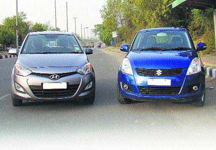 Hyundai i20 and the The Maruti Swift (right) Battle of hatches
