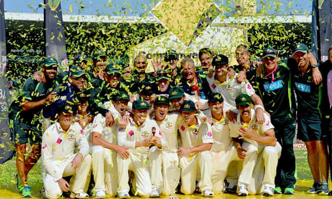 Australia's cricket team players celebrate 5-0 victory in the Ashes Test Cricket series against England with Urn and series trophy at the Sydney Cricket Ground. (AFP Photo)
</div) Australia's cricket team players celebrate 5-0 victory in the Ashes Test Cricket series against England with Urn and series trophy at the Sydney Cricket Ground. (AFP Photo)
</div)