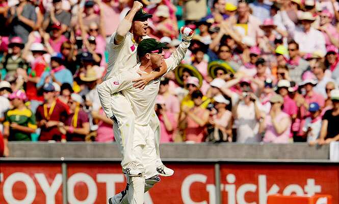 Australia's Brad Haddin gives teammate David Warner a ride on his back after defeating England on the third day of the fifth Ashes cricket Test at the Sydney Cricket Ground. (AFP Photo)
</div) Australia's Brad Haddin gives teammate David Warner a ride on his back after defeating England on the third day of the fifth Ashes cricket Test at the Sydney Cricket Ground. (AFP Photo)
</div)