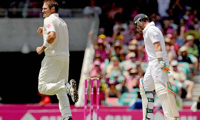 Australian bowler Ryan Harris runs through after dismissing England batsman Ian Bell (R) on the third day of the fifth Ashes cricket Test at the Sydney Cricket Ground. (AFP Photo)
</div) Australian bowler Ryan Harris runs through after dismissing England batsman Ian Bell (R) on the third day of the fifth Ashes cricket Test at the Sydney Cricket Ground. (AFP Photo)
</div)