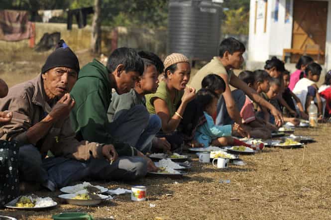 Karbi people in a relief camp set up in Sardoka Engti government school. Clashes between tribes in the northeastern Assam state have left 16 dead and forced thousands to flee, in Balisanda Assam. (Burhaan Kinu/HT)</strong> </div)