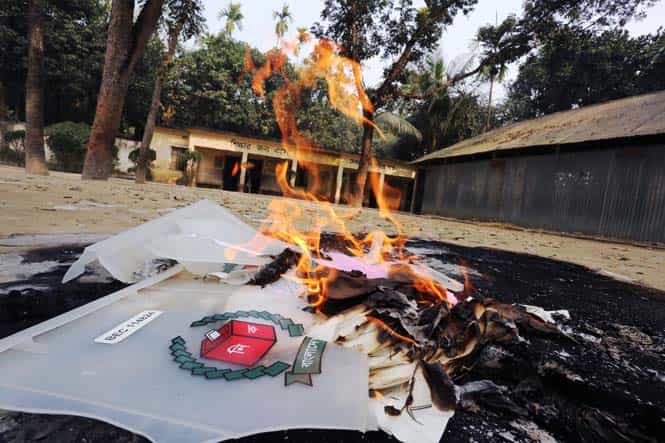 Election materials burn following an attack on a polling station in the northern town of Bogra. (AFP Photo)
</div) Election materials burn following an attack on a polling station in the northern town of Bogra. (AFP Photo)
</div)