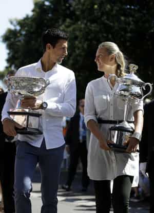 Defending champions Victoria Azarenka of Belarus and Serbia's Novak Djokovic pose with their trophies prior to the official draw of the Australian Open 2014. (AP Photo)
</div) Defending champions Victoria Azarenka of Belarus and Serbia's Novak Djokovic pose with their trophies prior to the official draw of the Australian Open 2014. (AP Photo)
</div)