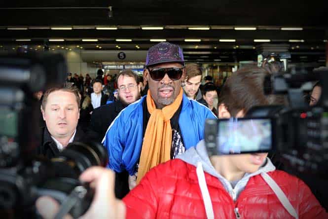 Former US basketball player Dennis Rodman (C) is surrounded by the media as he arrives at Beijing International Airport from North Korea after a seven-day trip. (AFP)</font></em></strong) Former US basketball player Dennis Rodman (C) is surrounded by the media as he arrives at Beijing International Airport from North Korea after a seven-day trip. (AFP)</font></em></strong)