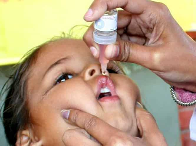 A volunteer administers polio drops to a child in Patiala on Sunday. (Bharat Bhushan/HT photo)
</div) A volunteer administers polio drops to a child in Patiala on Sunday. (Bharat Bhushan/HT photo)
</div)